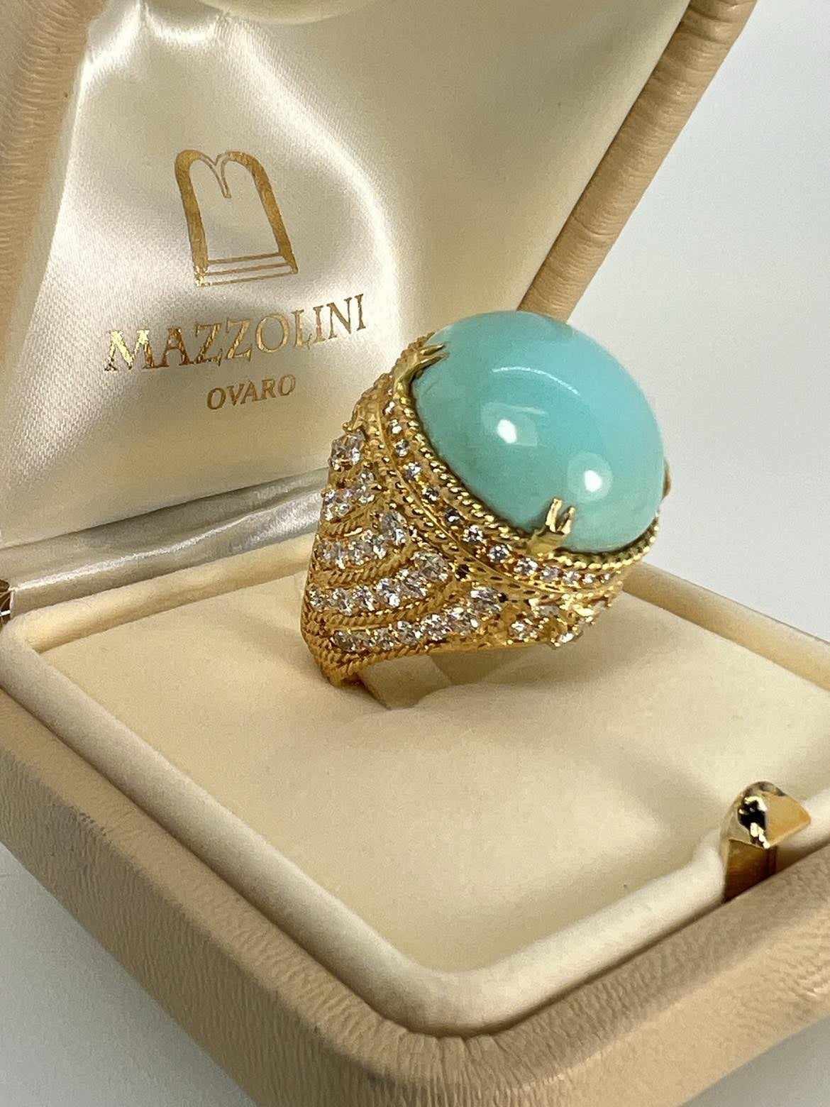 Importante anello in oro con grande Turchese iraniano e Diamanti taglio brillante.